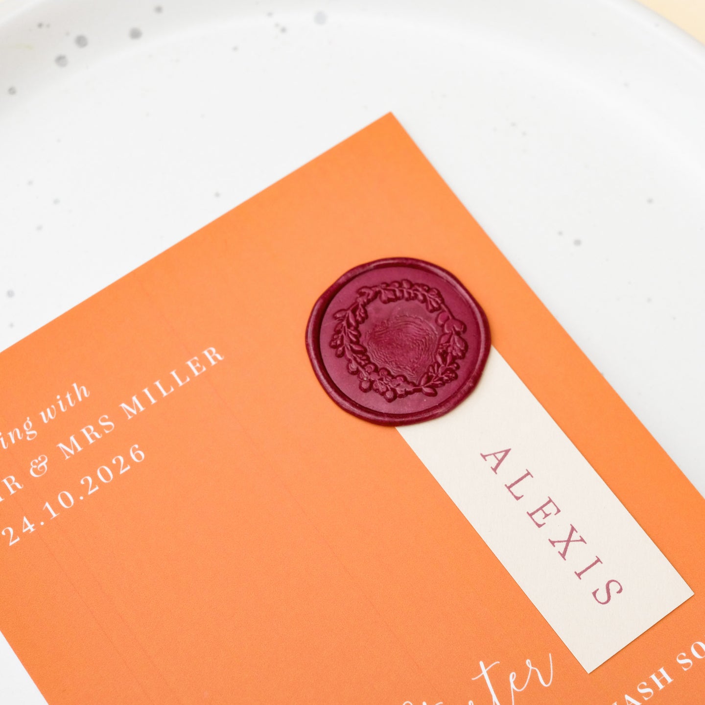 burnt orange wedding menu with guest name and wax seal